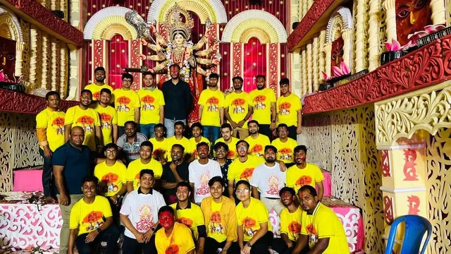 পূজামণ্ডপে প্রতিমার সামনে কমিটির সদস্যরা